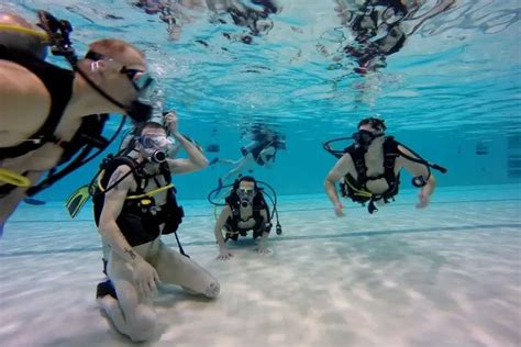 scuba naked|Naked Diving – The 100th Scuba Dive Tradition